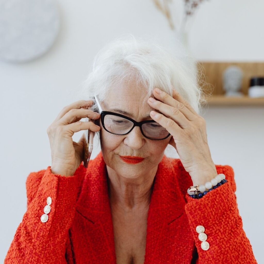 stressed older woman on the phone