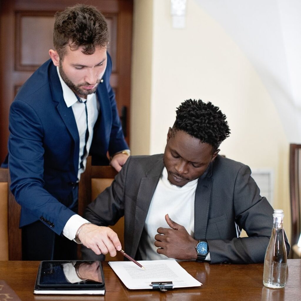 two people looking over documents at an appointment