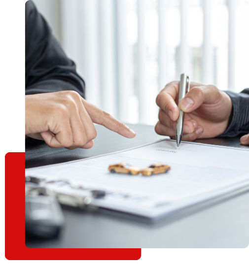 Insurance Disputes image 3 signing paperwork with little cars resting on the top
