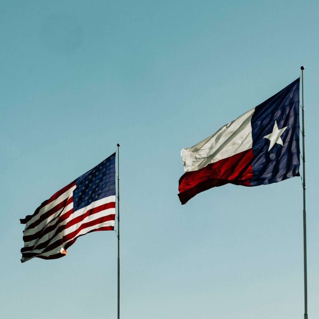 American and Texan flag blowing in the wind