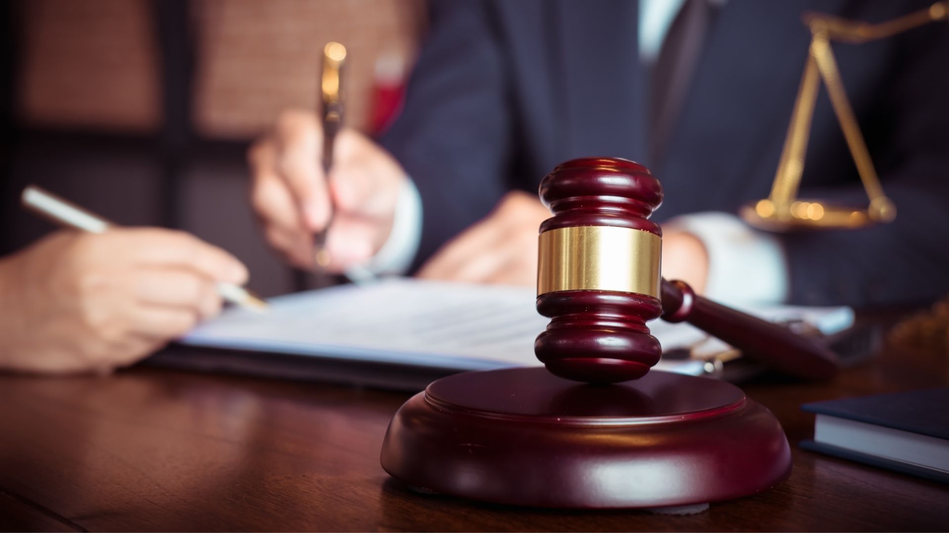lawyer with judges gavel on desk